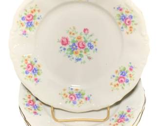 2352 - 4 Bavarian "Leonora" Plates 7" (Description): A four-piece set of Bavarian "Leonora" plates  featuring delicate floral designs. Each  plate measures 7 inches in diameter with gold  trim accents along the scalloped edges.