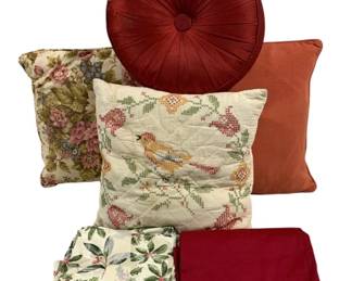 2051 - Assorted Pillows & Linens (Description): A lot of assorted pillows and linens. The  collection includes decorative throw pillows  in various styles and colors, along with  folded fabric linens.
