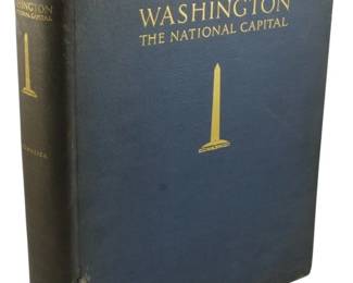 242 - 1932 1st Ed. Washington: The National Capital (Description): First edition of Washington: The National  Capital, published in 1932. This hardcover  volume features a dark blue cloth binding  with gilt lettering and a decorative gilt  Washington Monument illustration on the front cover and spine. The book shows some  age-related wear consistent with its vintage.