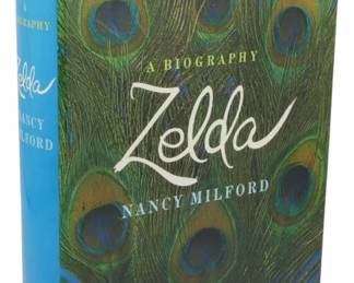45 - 1970 1st Ed. Zelda A Biography Nancy Milford (Description): First edition of Zelda, A Biography by Nancy  Milford, published in 1970. This hardcover  book comes with its original dust jacket  featuring a striking peacock feather design  in shades of green and blue. The dust jacket shows some wear at the edges and spine,  consistent with age. A definitive biography  of Zelda Fitzgerald, wife of author F. Scott  Fitzgerald.