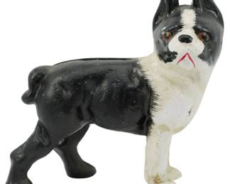 96 - Cast Iron Boston Terrier Dog Figure 4.5" (Description): A charming cast iron dog figure depicting a  Boston Terrier in a standing pose. The piece  features hand-painted details with a classic  black and white coat pattern, expressive  brown eyes, and subtle red mouth detailing. The figure displays characteristic vintage  paint wear consistent with age and use.  Measures 4.5 inches.