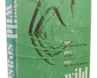62 - 1967 First Edition Wild Season Allan Eckert (Description): A 1967 first edition of Wild Season by Allan  W. Eckert. This hardcover book features a  dust jacket with an illustration of cattails  and water, depicting the nature survival  theme of the work. The jacket notes describe the story's setting as a lake during the  month of May, focusing on survival in nature.