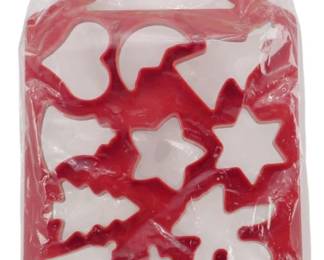 261 - Vtg One Step Cookie Cutter Christmas Shapes (Description): Vintage One Step Cookie Cutter in original  packaging. This red plastic cookie cutter  sheet features multiple Christmas-themed  shapes including a Christmas tree, stars,  candy cane, snowman, bells, and other holiday designs. Made in Hong Kong by Christmas  Around the World. The all-in-one design  allows for cutting multiple cookie shapes  from a single sheet of dough.