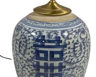 2085 - Ceramic Blue/White Lamp Base 14" (Description): A ceramic blue and white lamp featuring  traditional Asian-inspired decorative  patterns. The lamp measures 14 inches in  height and is mounted on a carved wooden base  with brass hardware. Used as is electric/electronic/mechanical  item. No guarantee all components, untested.