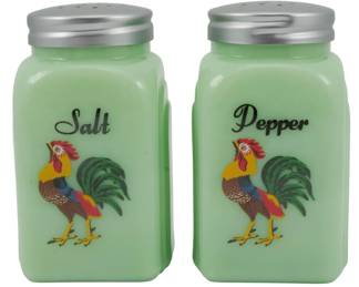 157 - Jadeite Salt and Pepper Shakers w/ Rooster 4" (Description): Pair of jadeite glass salt and pepper shakers  featuring colorful rooster motifs. Each  shaker displays the word "Salt" or "Pepper"  in script lettering above the rooster design.  The shakers have metal screw-on lids with dispensing holes. Measures 4 inches tall.