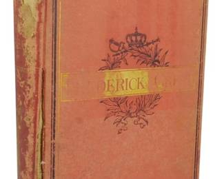 42 - 1871 Illustrated Ed. History of Frederick II (Description): An 1871 illustrated edition of the History of  Frederick the Second. The book features a  decorative red cloth cover with gilt  lettering and ornamental crown and floral  motifs on the front board. The binding shows considerable wear with fraying to the cloth  spine and corners, and overall aging  consistent with its age. The cover displays  the title 'Frederick' with royal insignia  embellishments.