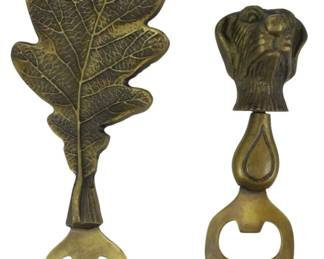 166 - 2 Figural Bottle Openers (Description): Oone featuring an oak leaf design with  detailed vein work, and one with a dog head  finial. Both openers have traditional bottle  cap opening mechanisms at the base.