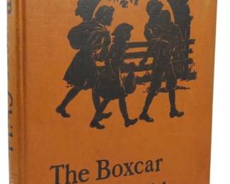 29 - 1942 Edition The Boxcar Children (Description): A 1942 edition of The Boxcar Children by  Gertrude Chandler Warner. This hardcover  volume features the classic orange cloth  binding with dark blue silhouette  illustration depicting the four Alden children on the front cover. The book shows  age-appropriate wear consistent with its  vintage status.