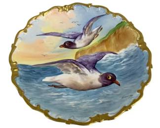 2044 - Limoges Hand Painted Plate 10.5" round (Description): Limoges hand painted plate featuring a scenic  design with a gilt scalloped edge. Measures  10.25 inches round.