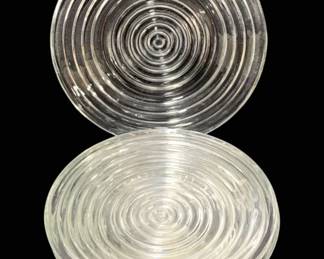 2024 - 7 Glass Plates 6" (Description): A set of seven glass plates featuring a  concentric circle design. Each plate measures  6 inches in diameter.