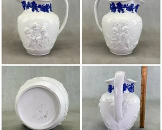 More views of the rare antique Wedgwood "Bacchanalian Boys" pitcher, 7-1/2”H, white jasper, decorated with Classical imagery of young boys and satyrs in Bacchic revelry (with grapes and grape leaves in their hair.) On one side, a young Bacchus holding his thyrsus (fennel staff) is being held aloft by two other boys, a vessel of wine beside them; the other scene has a satyr and young Bacchus sitting beneath a tree. The neck of the pitcher has applied blue sprig band of fruiting grape vines. Marked with "WEDGWOOD" to the base, dating 1790 to 1820.