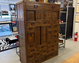 Antique Japanese choba tansu (merchant's chest) originally made for shopkeepers and traders. Used to store documents, ledgers, and shop goods. Multiple graduated drawers and sliding compartments; hand-forged iron hardware. 48"W x 19"D x 67"H.