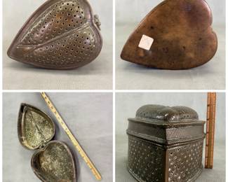 A vintage betel leaf-shaped pandan box, brass, from the Deccan region. The 5-inch tall box has geometric open fretwork designs on the hinged lid and sides, with engraved floral designs between them. 