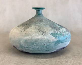 A Murano Cenedese glass vase circa 1960s, blown blue glass treated with the Scavo technique that makes the surface look old, having the appearance of glass from an archeological excavation (the word scavo in Italian means dig.) 8-1/4”W x 5-3/4”H. Designed by Alfredo Barbini, artisan at the Ars Cedenese workshop founded in 1946 by master glassmaker Gino Cenedese.