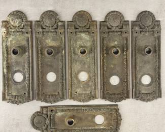 A collection of antique bronze door hardware from a Cook County building, Seal of Cook County on the plates