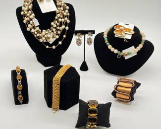 Stylish vintage costume jewelry - A 1950s copper cuff bracelet that's very mid-century modern; an amber cabochon and silver-toned link bracelet, multi-strand faux pearl and fold-tone spacer bead necklace, fun earrings and modernist brooch