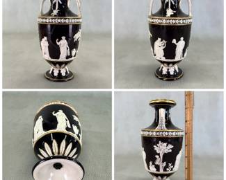 More views of the antique 1850's Wedgwood black dip jasper ware double handled urn shaped vase, 7-1/2"H, with applied classical figures in white relief depicting the muses of comedy/drama, music, poetry; covered overall in a shiny clear glaze and with applied gilding. Wedgwood stamp to the base along with group of 4 "mustache" marks, and hand-incised numerals 350. See example in of this vase in the Nelson Provincial Museum, Australia.
