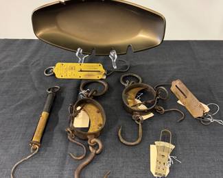 Antique tubular hanging spring scale, an antique Mancur Spring Balance Scale with hand-forged wrought iron or steel frame with a crescent-shaped unpolished brass dial, 19th century; a John Chatillon & Sons brass spring balance hanging pocket scale with a 50 lb capacity.