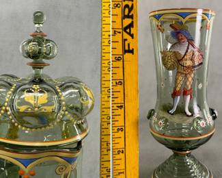 Closeups of the stunning antique Bohemian glass pokal set from the late 19th century, consisting of a dark green glass lidded, footed, narrow tankard with handle, decorated with elaborate polychrome enamel paintings of Renaissance-era Landsknecht soldiers, and a matching set of four smaller footed beakers. The tankard—with lid—is 22 inches high! Each beaker is approximately 7-3/4” H.