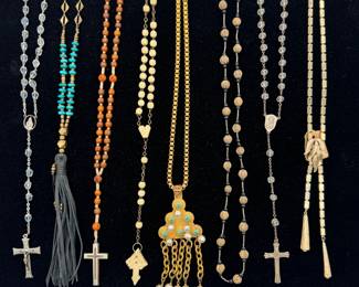 Vintage rosaries, an Owens brass and turquoise necklace with long black leather tassel, a 1960s Trifari gold-tone lariat bolo necklace featuring a block-link or square-mesh flexible chain, accented with a textured leaf slider clasp; a signed Miriam Haskell baroque pearl articulated pendant necklace, 18.5 inches long.