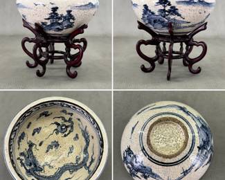 One of a pair of Chinese porcelain bowls, with underglaze blue hand-painted landscape scenes to the exterior and a dragon chasing flaming pearl of wisdom on the interior, beneath a band of clouds. Heavy crackled Ge ware style glaze, unglazed footrims.  Each bowl comes with dark-stained, hand-carved hardwood or rosewood pedestal stand featuring five curved legs. Bowl 7"W x 3-1/26"H, total height with stands 6-1/4".
