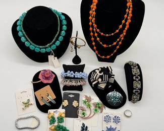 Stylish vintage brooches and earring sets including a vintage Coro blue floral demi-parure set featuring a large dahlia-style layered enamel-on-metal brooch and matching clip-on earrings with blue rhinestone center accents; turquoise-style beaded necklaces, cluster beaded bracelets, Fabrice Paris anemone brooch, a felted "all sorts" dimensional brooch, and more