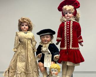 A 17" Armand Marseille "Mabel" doll, bisque shoulder head, leather body, wearing antique clothing; a rare Alt Beck and Gottschalk bisque head boy doll, with ABG marking and 1352/35-36; and a 21-inch Armand Marseille 370 bisque head doll in red velvety dress and hat