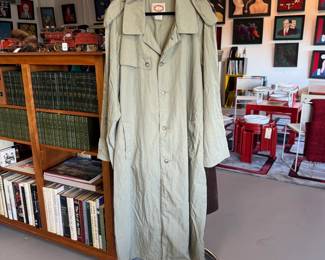 Why yes that's a lightweight trench coat, but look there's antique toys, mid-century modern furniture, outsider artist paintings, collectible antique and vintage books as well!
