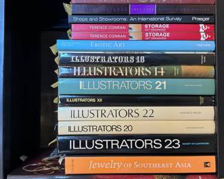 Books including Storage Get Organized by Terence Conran, several hardcover volumes about illustrators by the Society of Illustrators, Atlas of Anatomy for Illustrators, Jewelry of Southeast Asia by Richter, Ethnic Jewelry published by the Vendome Press, and Erotic Art by Angelika Muthesius and Gilles Néret