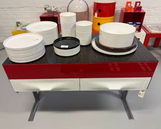 A rare Raymond Loewy two-drawer console table circa late 1960s to early 1970s, The fronts moulded in white and vivid red Metacrylene, with a rosewood top and brushed aluminum legs, from our collection of Raymond Loewy "DF2000" series furniture produced for Doubinsky Freres. 
