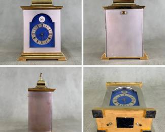 More views of the vintage brass-gilded carriage clock / bracket clock with blue enamel framing, manufactured by the famous British clockmaking firm Thwaites & Reed. Runs; the clock face with stylized Roman numerals with star markers between them and elegant gold-toned openwork hands. A vibrant royal blue enamel arched backdrop surrounds the dial, and it is marked with the brand crest at the 12 o'clock position and "Made in England" subtly at the bottom. Comes with original paperwork from Thwaites & Reed Limited.