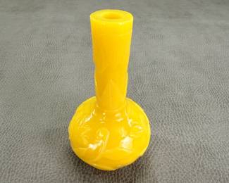 A Chinese Peking glass vase, vivid yellow, the globular body rising from a short flat foot to a tall neck, carved in relief around the exterior with foliate sprays, the neck with symmetrical bands of leaves. 4-5/8”H.