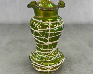 Gorgeous Bohemian art glass vase, green glass with iridescent green-gold-magenta finish with applied cream-color threads, the rim pulled into three flaring curves; 6-3/4"H. Likely by Kralik or Pallme König & Habel, early 1900s.