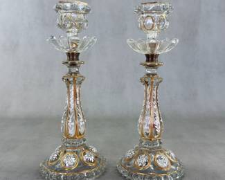 A pair of antique French Baccarat crystal medallion pattern white enameled and gilded candlestick holders