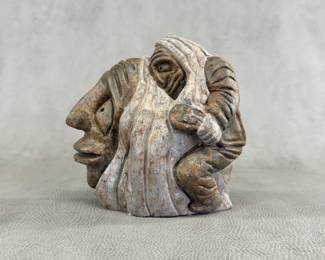 Carved stone folk art figure, approx. 6"W x 6"H x 3"D.