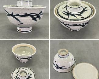 A vintage Japanese studio pottery lidded bowl with a speckled off-white glaze and hand-painted dark blue bamboo leaf motifs; 4-3/4" H.