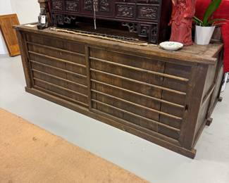Lower section of a beautiful antique two-section Japanese Mizuya Tansu, a kitchen or tea room chest, with hand forged iron hardware. In two sections, the upper portion has two sets of sliding doors with storage space behind each, and five side-by-side drawers along the lower part. The bottom section has 2 sliding doors with spacious storage with shelving behind. The top cabinet measures 74”W x 20-1/4”D x 39”H and the lower cabinet measures 74”W x 20-1/4”D x 28”H.