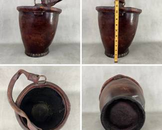 Antique late 18th/early 19th century leather fire bucket, well-patinated and brass riveted leather bucket of tapered form with rolled top edge, metal loops attaching the loop handle. 12-3/4” tall, at top of the metal handle loops.  