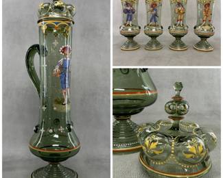 More views of the stunning antique Bohemian glass pokal set from the late 19th century, consisting of a dark green glass lidded, footed, narrow tankard with handle, decorated with elaborate polychrome enamel paintings of Renaissance-era Landsknecht soldiers, and a matching set of four smaller footed beakers. The tankard—with lid—is 22 inches high! Each beaker is approximately 7-3/4” H.