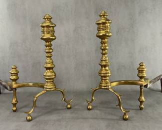 Antique American 19th century brass andirons (also known as fireplace dogs) with elaborately turned columns and graceful curved spurred legs resting on ball feet.