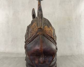 Carved wooden ceremonial helmet Female Bundu society, Sierra Leone, Mende people. 18 inch height.