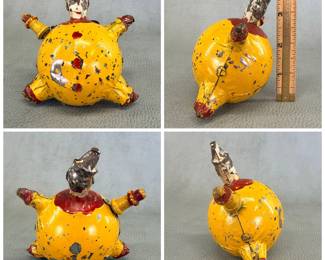 Antique Schoenhut roly-poly clown toy, painted metal, 4" tall; originally manufactured by the Schoenhut Toy Company starting in the early 1900s