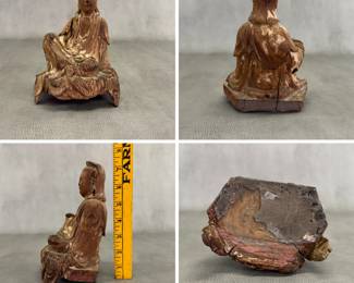 Antique Chinese carved wooden sculpture of the bodhisattva Guanyin seated in the royal ease posture; the wood with visible grain, weathered texture, and traces of old polychrome finish.  7-1/2 inches high.