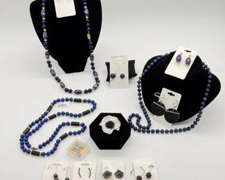 Cloisonné bead necklace, a lapiz lazuli round bead and black stone barrel bead necklace, a pair of gold and faceted sapphire jade bead earrings, a Ciléa Paris Anemone Brooch, a dark blue glass round beaded necklace, and more