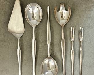Closeups of the Christofle France silver-plated "Duo" pattern cutlery service for 12, mid-century modern design classics. Tapio Wirkkala designed the iconic Duo flatware line for Christofle in 1957. The silver-plated cutlery was part of the Formes Nouvelles line (launched 1959) and is characterized by clean lines, with production largely occurring in the late 1950s and 1960s.