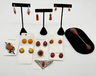 Natural amber earrings and brooches - from butterscotch yellow to rich deep warm orange red jewel tones. 