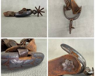 An antique Mexican charro or western cowboy riding spur, featuring a hand-forged iron body with incised diagonal and geometric patterns with silver inlay, an eight-pointed star rowel, and attached leather strap and buckle component with a peened leather button or connector.