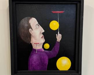 "Hot Dogging" – original painting on board by outsider artist D. L. Olejarczyk. Signed front and back, dated '02, framed, total size 18-3/8"W x 20"H. This painting features a man in a purple long-sleeve shirt standing in profile before a black background, his left arm raised balancing a spinning red plate, with a smaller spinning red plate perched on his shoulder, and three golden balls floating in space around him. Signed "D.L. Olejarczyk" with date in the bottom edge of the lower right-hand golden ball. 