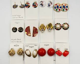 Earrings including Wild Swan earrings by Laurel Burch, 1960's Capril seashells, enameled Mynah Bird rondelles  by Laurel Burch,  and 1960's Lisner clip-on earrings featuring a bold blood-red or coral-orange thermoset or lucite square cabochon set in a gold-tone metal frame