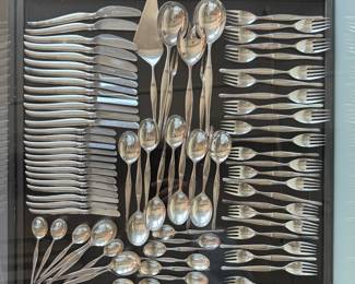 A group view of the Christofle France silver-plated "Duo" pattern cutlery service for 12, mid-century modern design classics. Tapio Wirkkala designed the iconic Duo flatware line for Christofle in 1957. The silver-plated cutlery was part of the Formes Nouvelles line (launched 1959) and is characterized by clean lines, with production largely occurring in the late 1950s and 1960s.